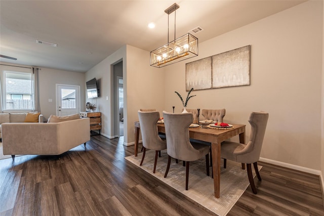 2230 Sand Lily Dr, Texas City, TX 77568 - dining area featuring visible vents, dark wood-style flooring, baseboards, and a chandelier