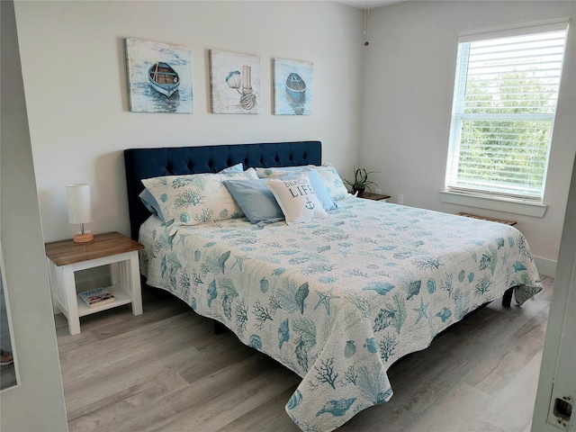 bedroom with hardwood / wood-style floors