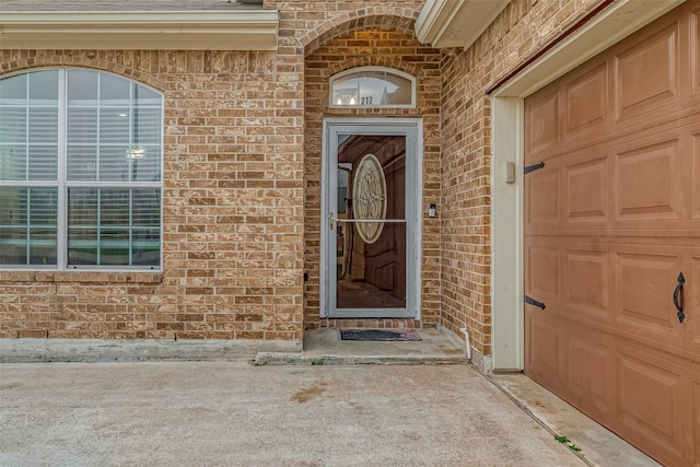 doorway to property featuring a garage