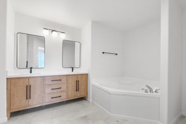 bathroom with vanity and a tub to relax in