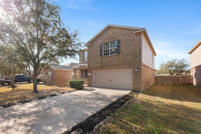 view of front of property with a garage and a front yard