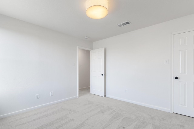 empty room with light colored carpet