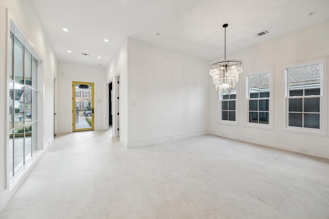 empty room with an inviting chandelier, baseboards, visible vents, and recessed lighting