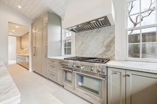 kitchen with range with two ovens, custom exhaust hood, tasteful backsplash, recessed lighting, and gray cabinets