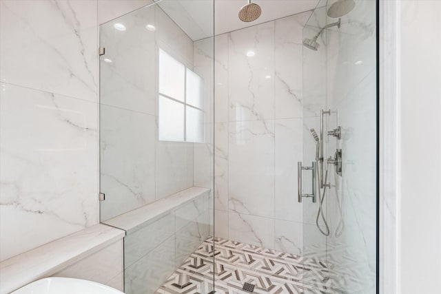 full bath featuring a marble finish shower