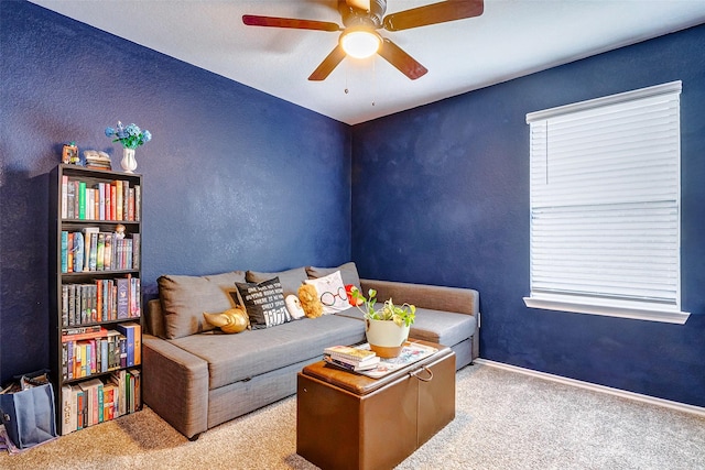 living room with ceiling fan and light carpet