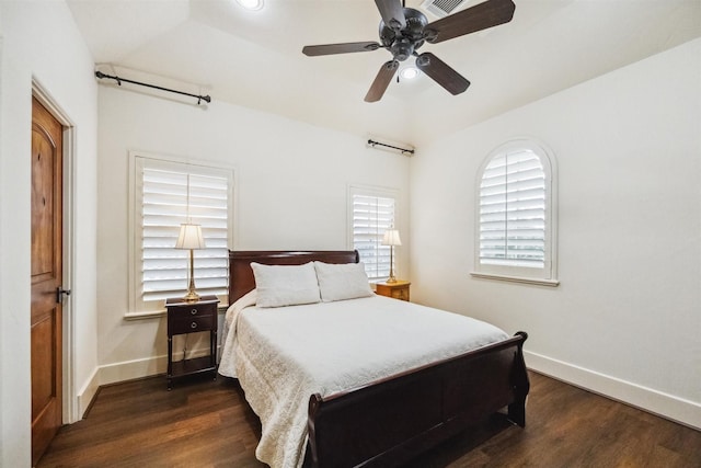 bedroom with dark wood-type flooring and ceiling fan