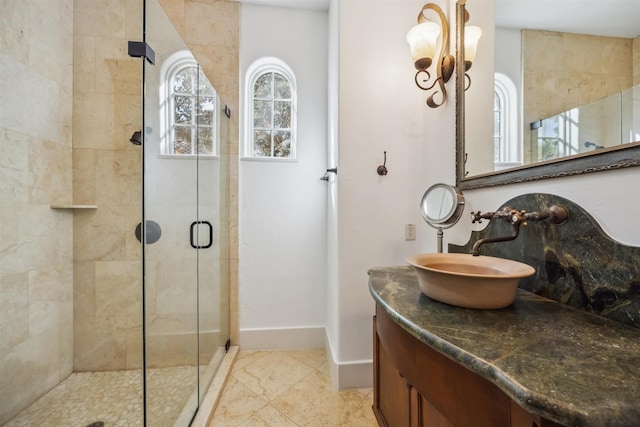 bathroom with vanity, tile patterned flooring, and a shower with shower door