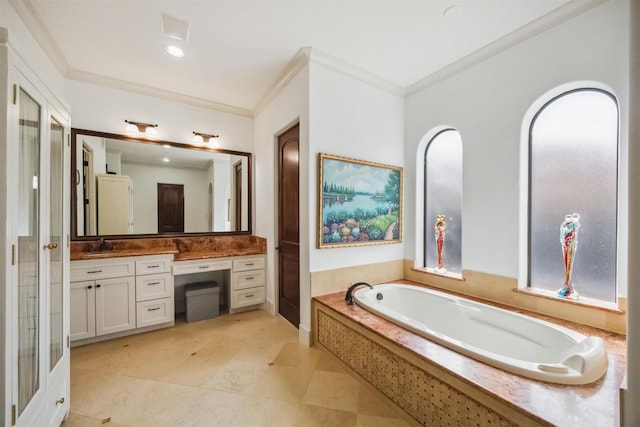 bathroom with tiled tub, vanity, and ornamental molding