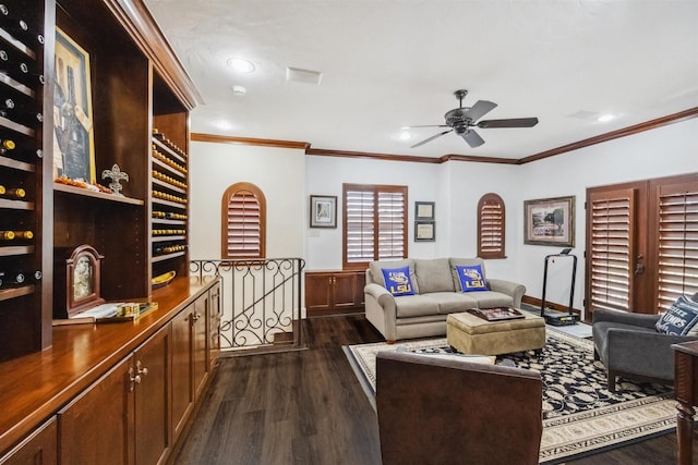 living room featuring crown molding, ceiling fan, and dark hardwood / wood-style flooring