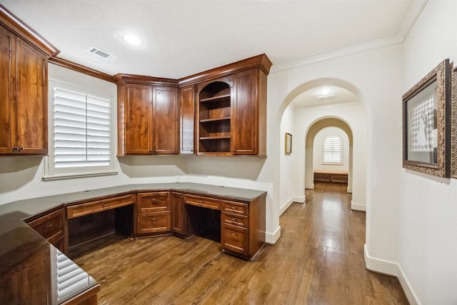 unfurnished office featuring hardwood / wood-style flooring and ornamental molding