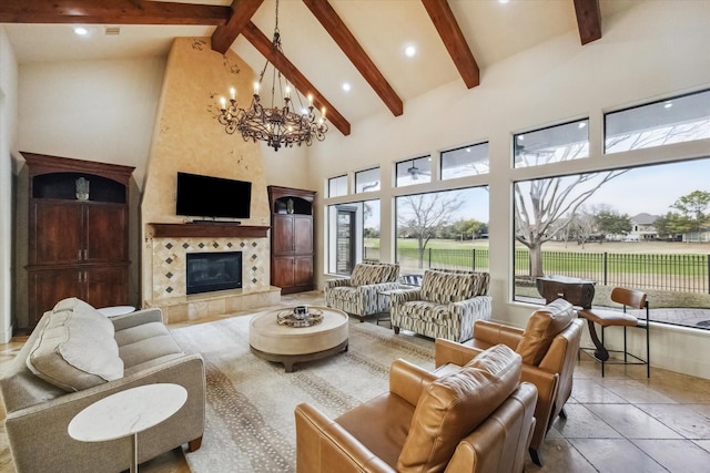 living room featuring beamed ceiling, a fireplace, high vaulted ceiling, and a notable chandelier