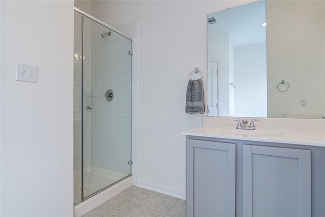 bathroom featuring vanity and a shower with door