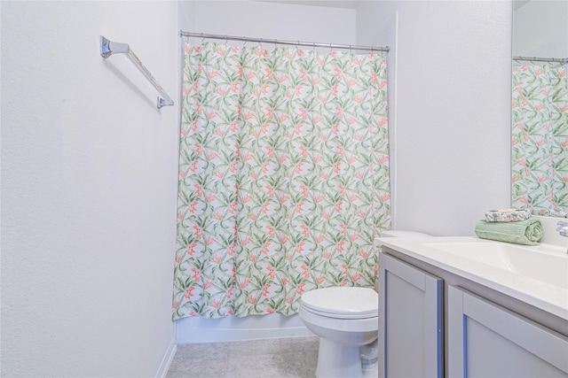 full bathroom featuring vanity, tile patterned floors, toilet, and shower / bath combo