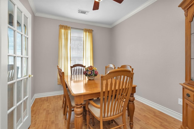 dining area featuring crown molding, ceiling fan, and light hardwood / wood-style flooring