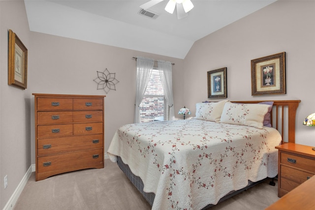 carpeted bedroom featuring vaulted ceiling and ceiling fan