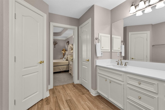 bathroom with vanity and hardwood / wood-style flooring