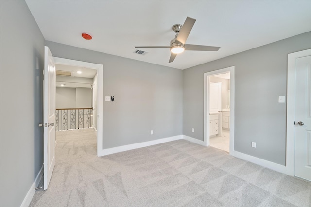 110 Broken Wheel Cir, Conroe, TX 77316 - unfurnished bedroom featuring light carpet, baseboards, ensuite bathroom, and a ceiling fan