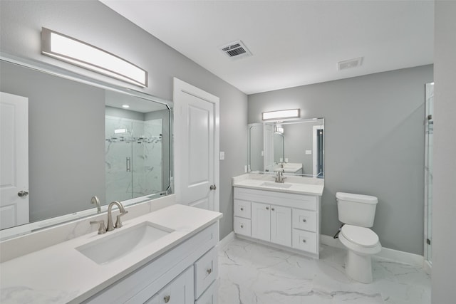 bathroom with vanity, toilet, and a shower with door