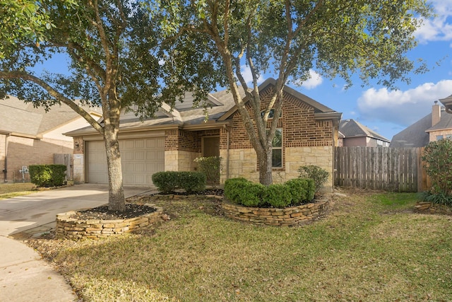 view of front of home featuring a garage and a front yard