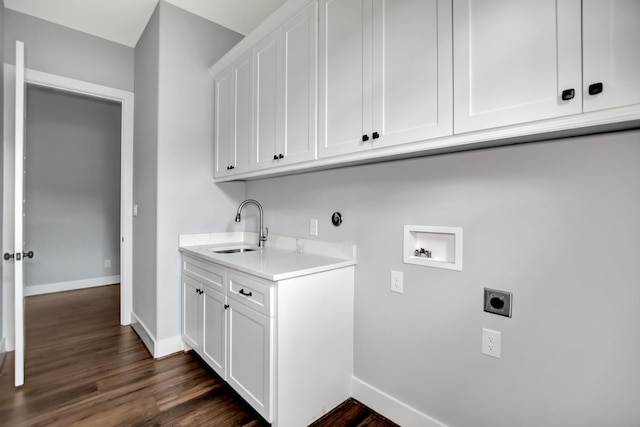 laundry room with sink, cabinets, washer hookup, dark hardwood / wood-style flooring, and hookup for an electric dryer