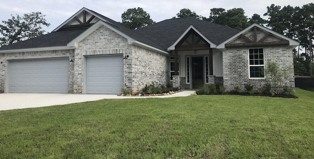 craftsman house featuring a garage and a front yard