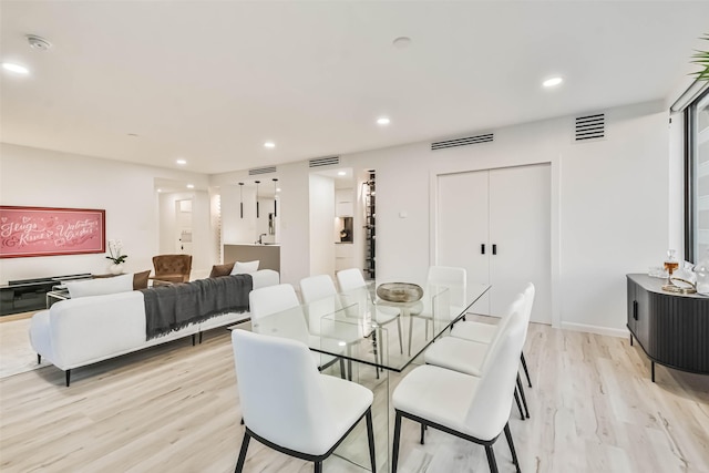 dining room featuring light hardwood / wood-style floors