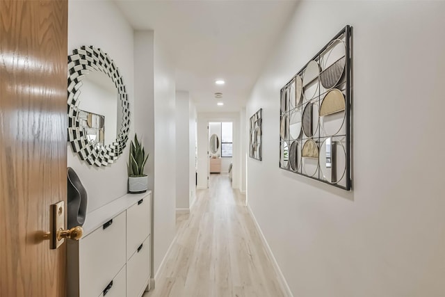 hallway with light wood-type flooring