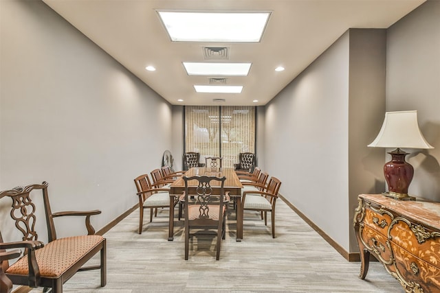 dining space with light colored carpet