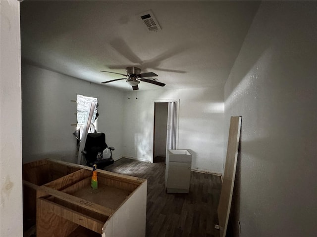 bedroom with ceiling fan and dark hardwood / wood-style flooring