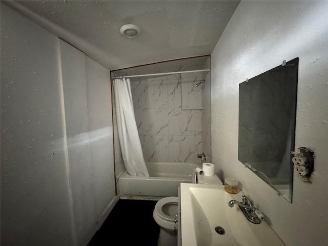 full bathroom with sink, shower / bath combination with curtain, and toilet