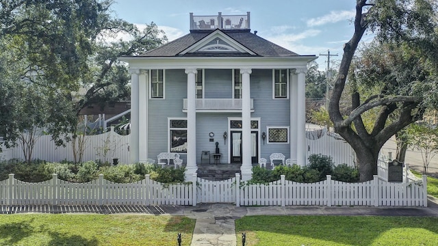 greek revival inspired property featuring a balcony