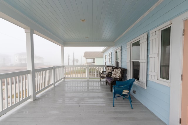 wooden deck featuring a porch