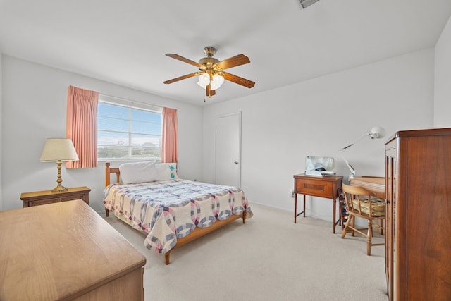 bedroom featuring light carpet and ceiling fan