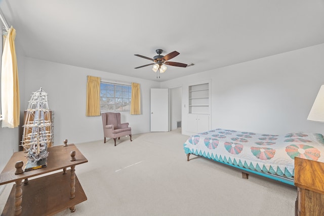 bedroom featuring light colored carpet and ceiling fan