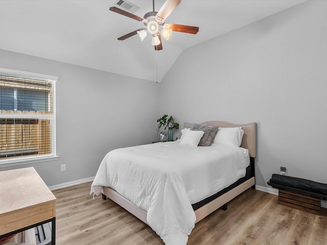 bedroom featuring vaulted ceiling, ceiling fan, and light hardwood / wood-style floors