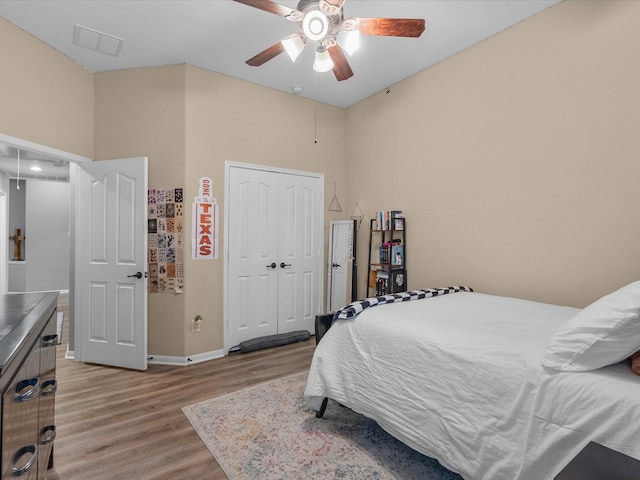 bedroom featuring a closet, ceiling fan, and light hardwood / wood-style flooring