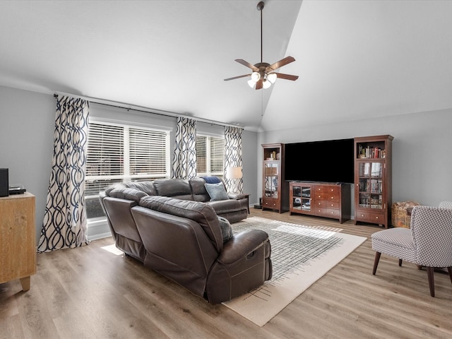 living room with lofted ceiling, wood-type flooring, and ceiling fan