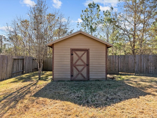 view of outbuilding with a yard