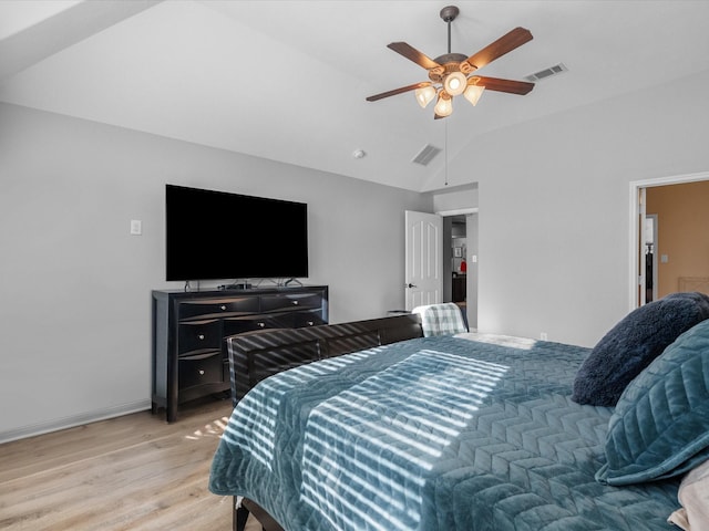 bedroom with vaulted ceiling, ceiling fan, and light hardwood / wood-style floors