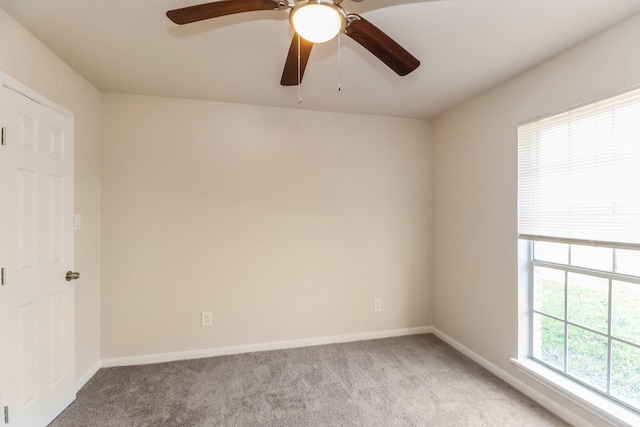 spare room featuring light colored carpet