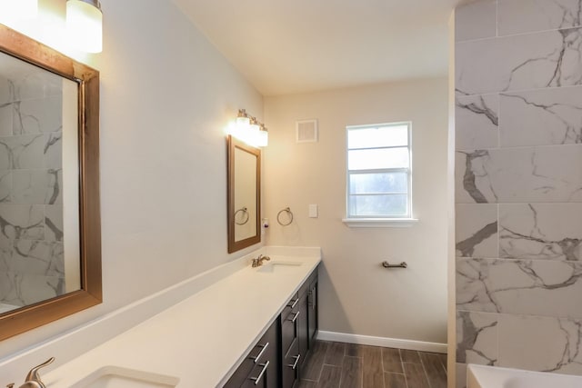 bathroom with lofted ceiling and vanity