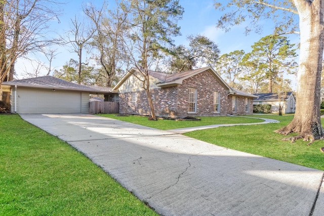 single story home with a garage and a front yard