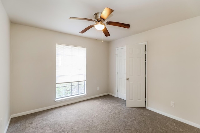 carpeted empty room with ceiling fan