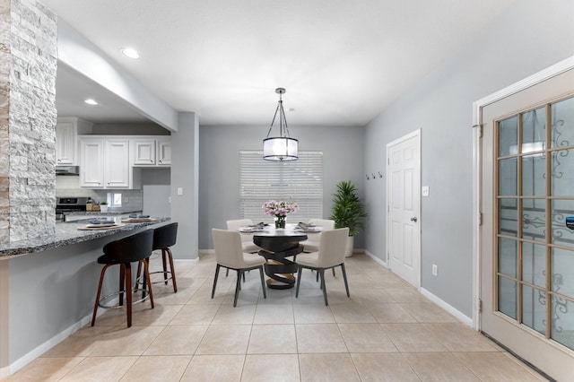 dining room featuring light tile patterned floors