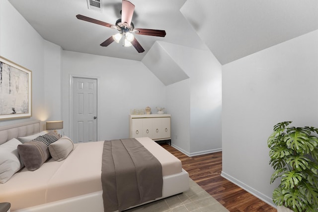 bedroom with ceiling fan and dark hardwood / wood-style flooring