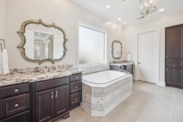 bathroom with vanity, tiled tub, and ornamental molding