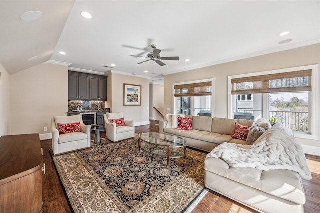 living room featuring ceiling fan, ornamental molding, hardwood / wood-style floors, and a wealth of natural light