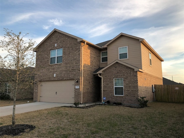 view of front property with a garage and a yard