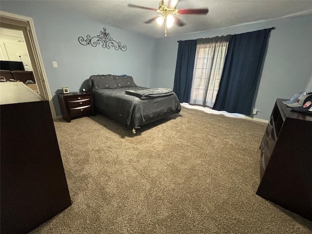 bedroom featuring ceiling fan and light carpet